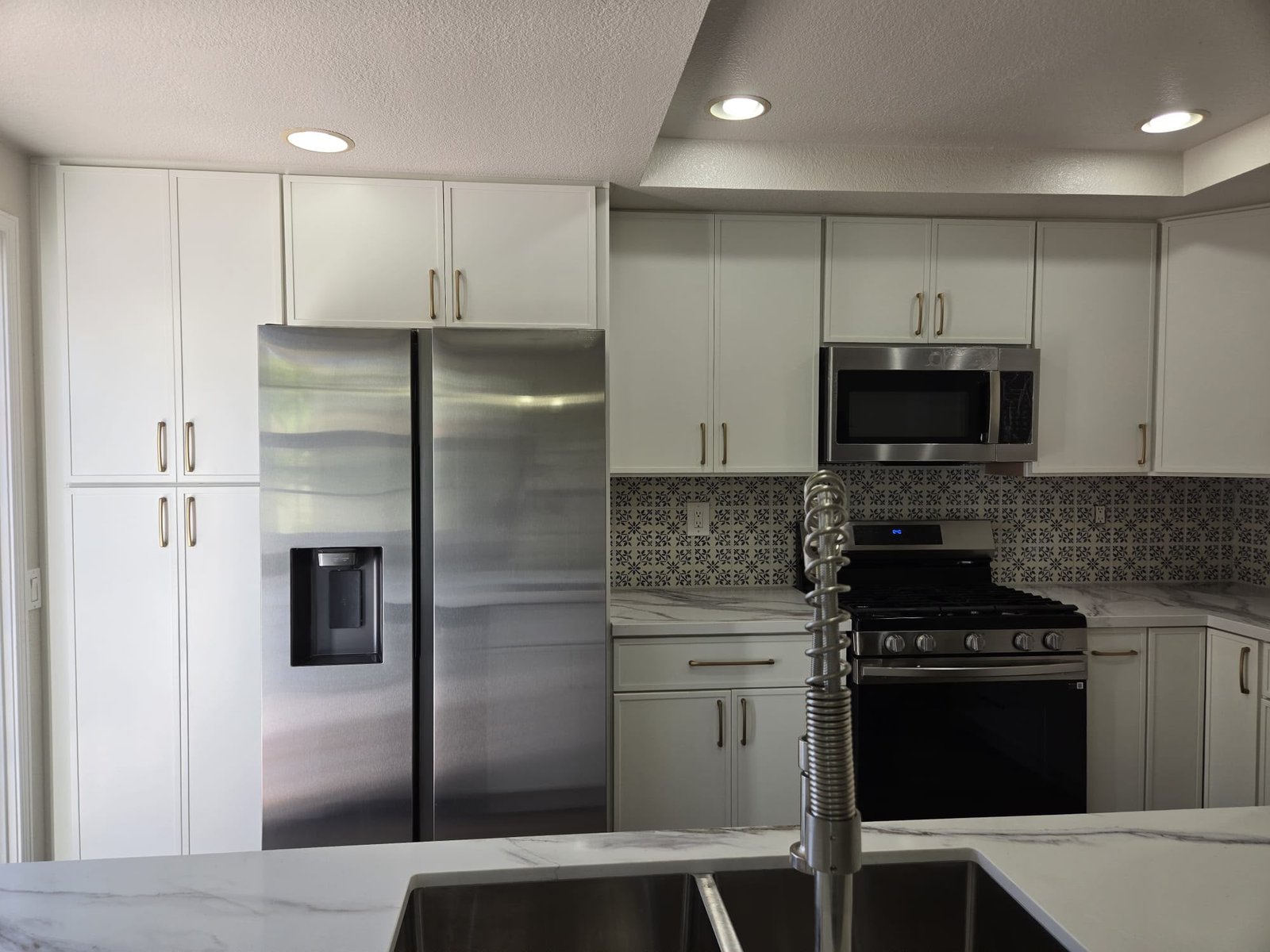 Kitchen remodel white cabinets by JC Painting Construction